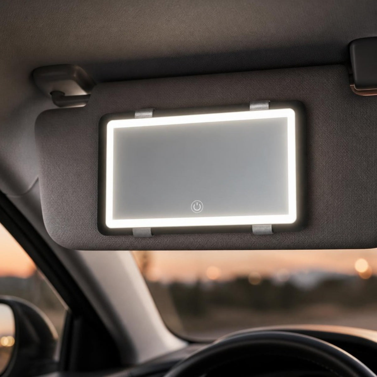 LED vanity mirror strapped to a car sun visor